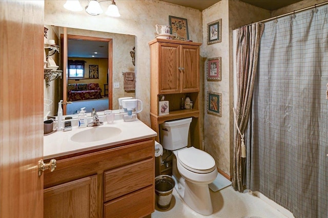 bathroom with vanity, a shower with curtain, and toilet