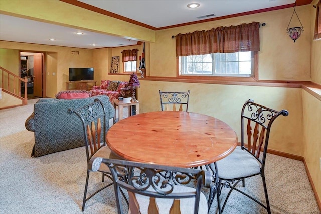carpeted dining space featuring stairway, a wealth of natural light, recessed lighting, and visible vents