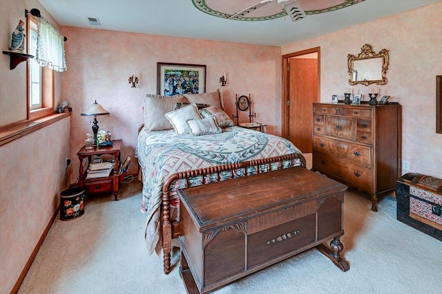 bedroom featuring visible vents, carpet, and baseboards