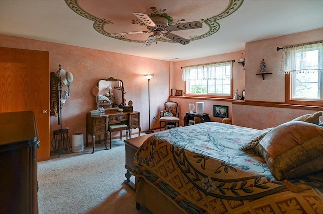 carpeted bedroom with a ceiling fan