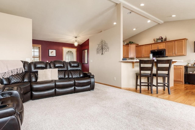 living area with baseboards, lofted ceiling with beams, recessed lighting, and light carpet