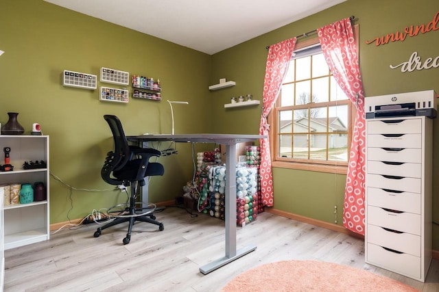 bedroom with baseboards and wood finished floors