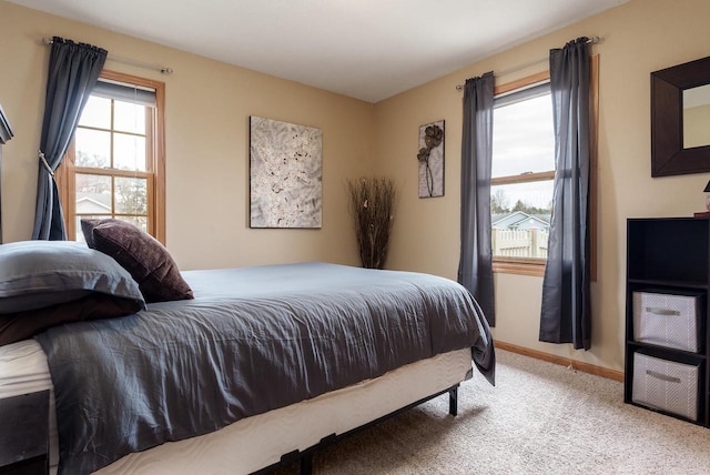 bedroom featuring carpet floors and baseboards