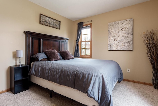 carpeted bedroom with baseboards