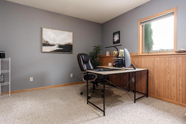 carpeted office space featuring baseboards