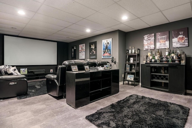 home theater room with a dry bar, a drop ceiling, and recessed lighting