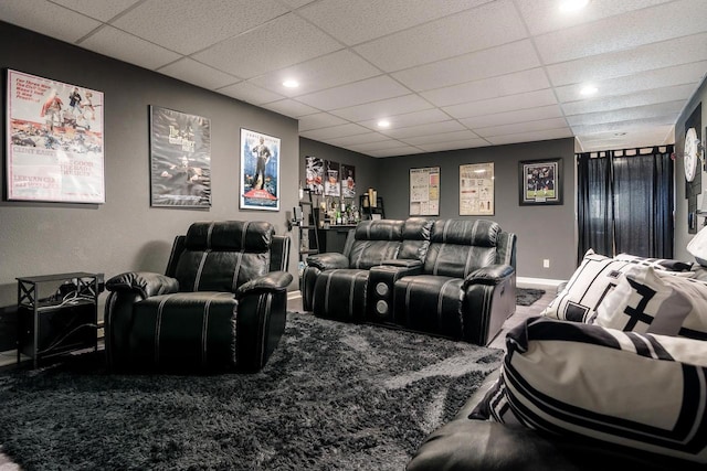 carpeted home theater with baseboards, a dry bar, recessed lighting, and a paneled ceiling