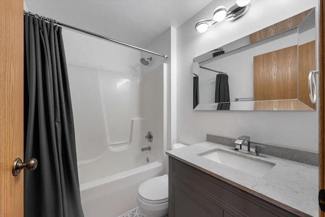 bathroom with vanity, toilet, and shower / tub combo