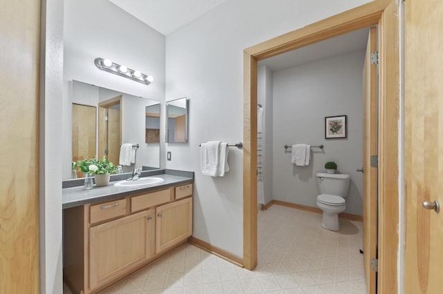 full bath with tile patterned floors, baseboards, vanity, and toilet