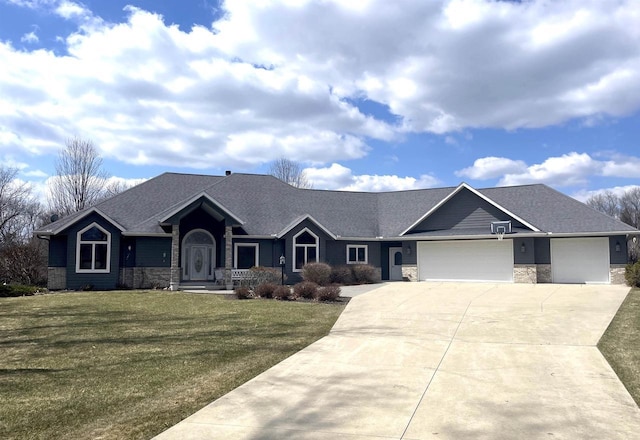 view of front of home featuring a front lawn, stone siding, roof with shingles, concrete driveway, and an attached garage