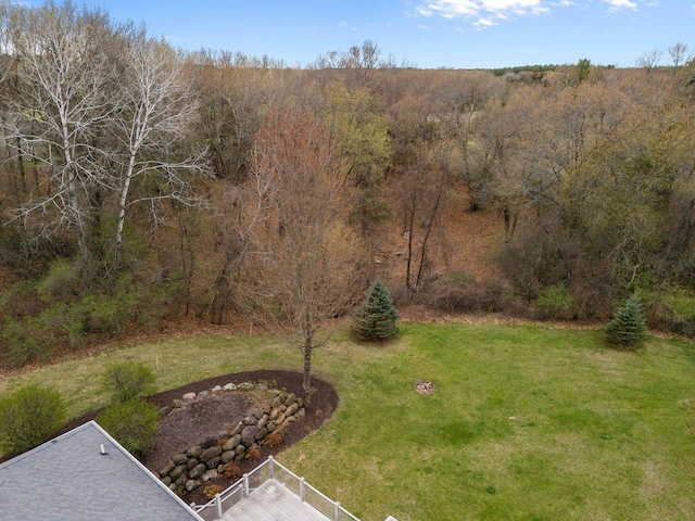 view of yard featuring a wooded view