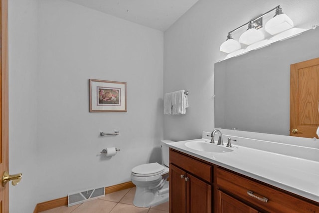 bathroom with tile patterned flooring, vanity, toilet, baseboards, and visible vents
