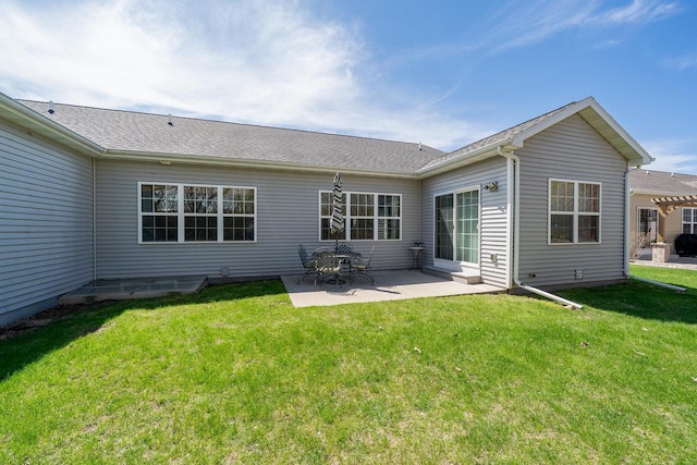 back of property featuring a patio area and a yard