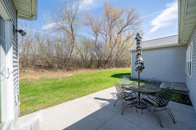 view of patio featuring outdoor dining area