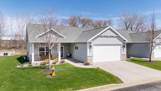 view of front of property with roof with shingles, a front lawn, stone siding, a garage, and a porch