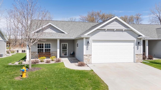 craftsman house with roof with shingles, stone siding, and a garage