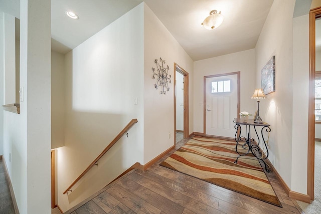 entryway featuring baseboards and hardwood / wood-style flooring