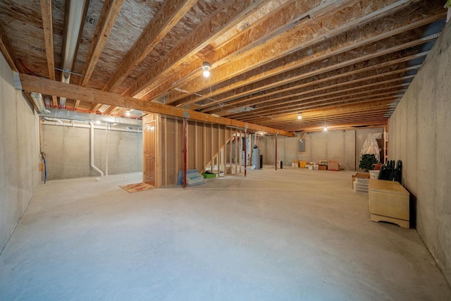 unfinished below grade area featuring gas water heater