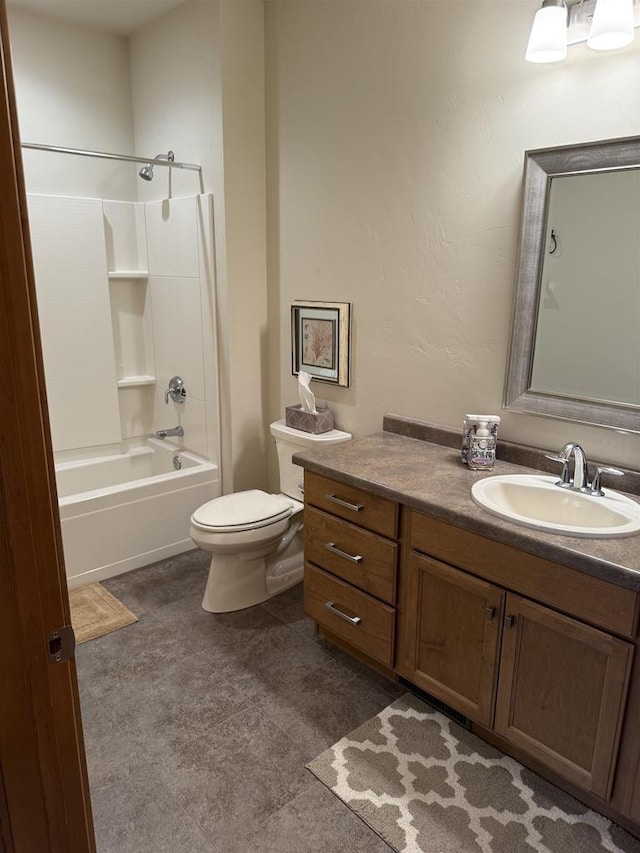 bathroom featuring vanity, bathtub / shower combination, and toilet