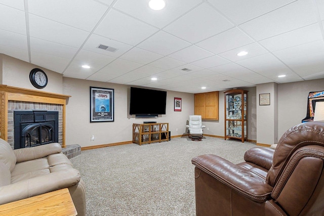 living room with carpet flooring, baseboards, visible vents, and a paneled ceiling