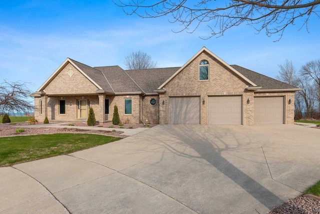 view of front facade with brick siding, an attached garage, driveway, and a front lawn