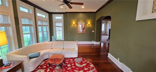 422 W Columbia St, Chippewa Falls, WI 54729 - living area featuring crown molding, arched walkways, ceiling fan, and wood finished floors