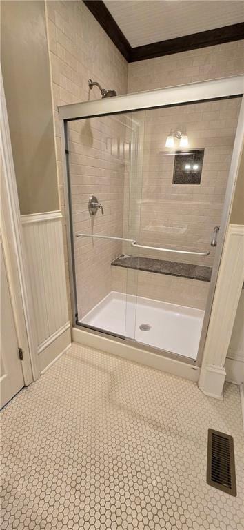 422 W Columbia St, Chippewa Falls, WI 54729 - bathroom featuring tile patterned floors, wainscoting, a stall shower, and visible vents