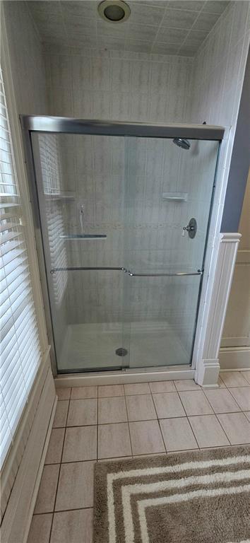 422 W Columbia St, Chippewa Falls, WI 54729 - bathroom with a stall shower and tile patterned floors