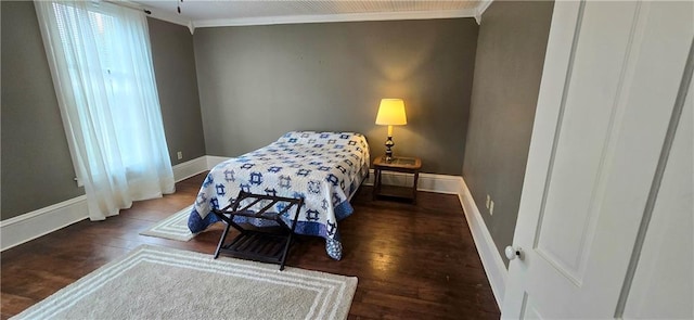 422 W Columbia St, Chippewa Falls, WI 54729 - bedroom with baseboards, ornamental molding, and wood finished floors