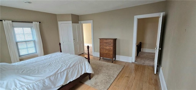 422 W Columbia St, Chippewa Falls, WI 54729 - bedroom featuring baseboards and light wood-type flooring