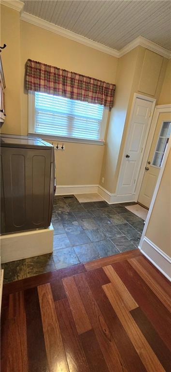 422 W Columbia St, Chippewa Falls, WI 54729 - bathroom featuring washer / dryer, baseboards, and ornamental molding