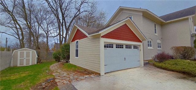 422 W Columbia St, Chippewa Falls, WI 54729 - garage with concrete driveway and a storage unit