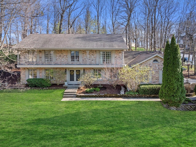 19425 Killarney Way, Brookfield, WI 53045 - view of front of house with brick siding, french doors, a balcony, and a front lawn