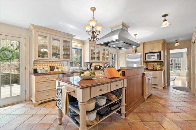 19425 Killarney Way, Brookfield, WI 53045 - kitchen with built in appliances, a kitchen island, island range hood, cream cabinetry, and tasteful backsplash