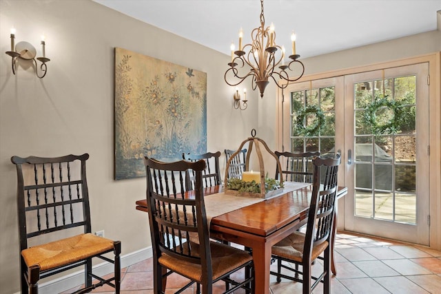 19425 Killarney Way, Brookfield, WI 53045 - dining space featuring baseboards, french doors, light tile patterned flooring, and a notable chandelier