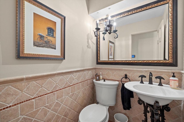 19425 Killarney Way, Brookfield, WI 53045 - bathroom with a sink, wainscoting, toilet, and tile walls