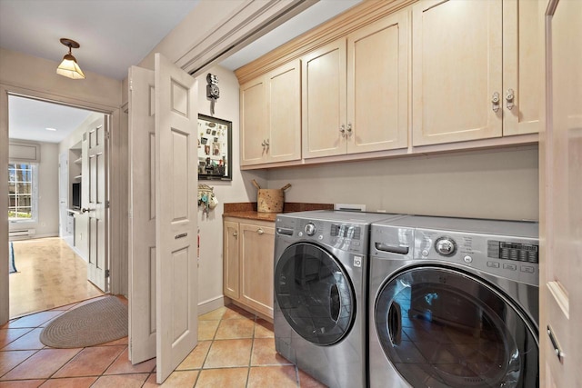 19425 Killarney Way, Brookfield, WI 53045 - laundry area with separate washer and dryer, a baseboard heating unit, cabinet space, and light tile patterned floors