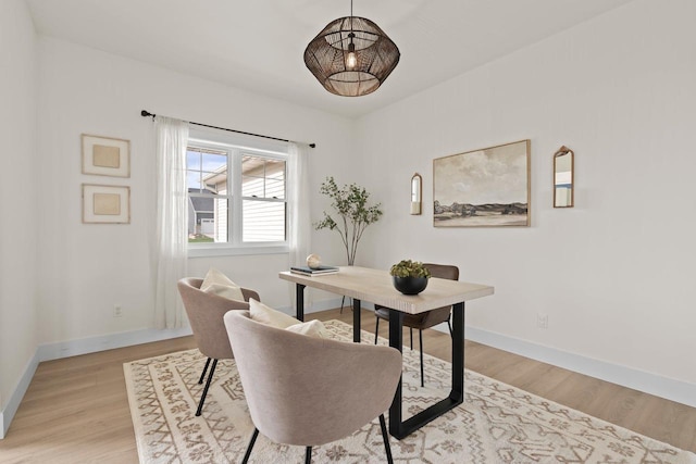 office space featuring light wood-style floors and baseboards