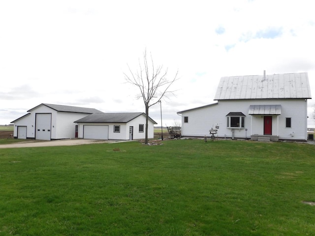 10621 Cth F, Newton, WI 53063 - view of yard featuring an outdoor structure, driveway, and a detached garage