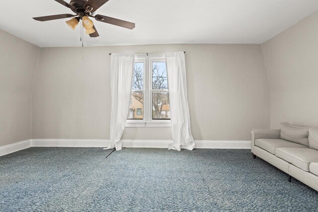 interior space with baseboards, carpet, and ceiling fan