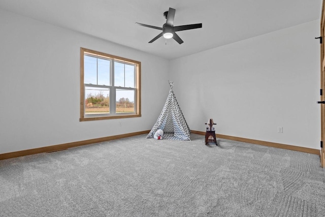 game room featuring carpet floors, baseboards, and ceiling fan