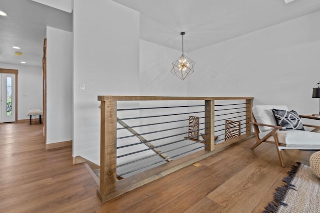 stairs featuring baseboards, recessed lighting, and wood finished floors