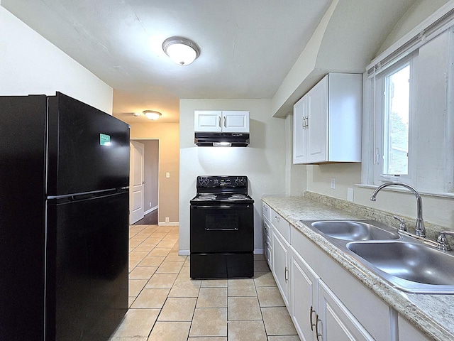 5870 N 72nd St, Milwaukee, WI 53218 - kitchen featuring under cabinet range hood, white cabinets, a sink, light tile patterned floors, and black appliances