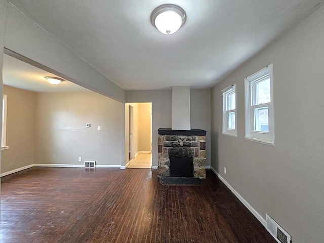 5870 N 72nd St, Milwaukee, WI 53218 - unfurnished living room with visible vents, baseboards, and hardwood / wood-style floors