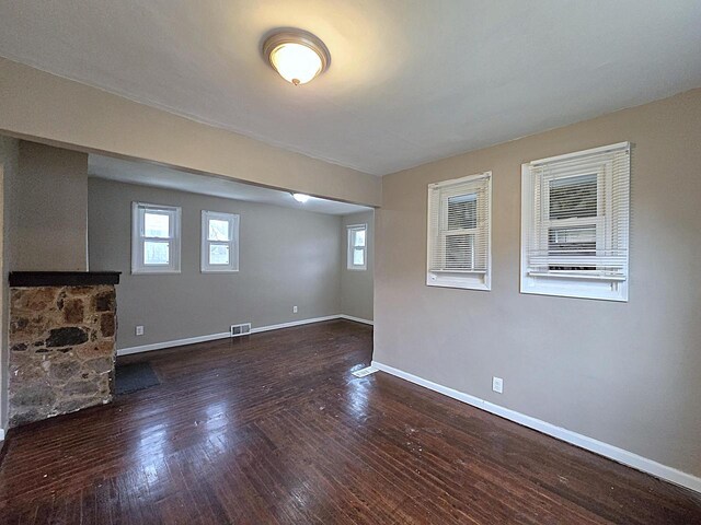 5870 N 72nd St, Milwaukee, WI 53218 - basement with baseboards, visible vents, and hardwood / wood-style floors
