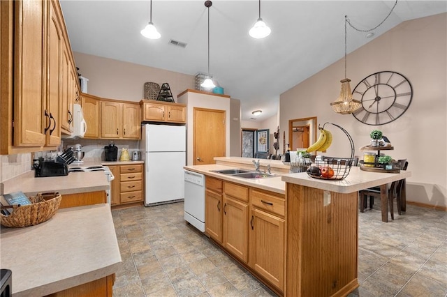 kitchen with backsplash, visible vents, a sink, light countertops, and white appliances