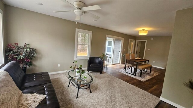 10039 State Highway 27, Hayward, WI 54843 - living area with baseboards, a ceiling fan, and dark wood finished floors