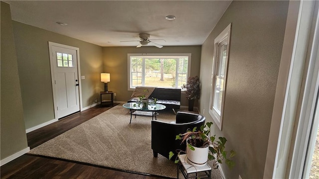 10039 State Highway 27, Hayward, WI 54843 - living room with baseboards, a ceiling fan, and dark wood-type flooring