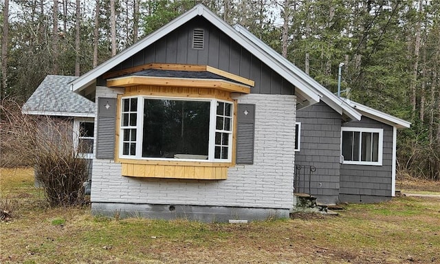 10039 State Highway 27, Hayward, WI 54843 - view of side of home featuring board and batten siding and brick siding