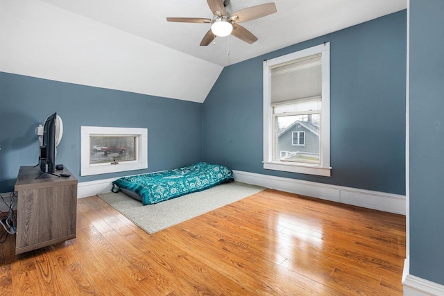 1221 S Madison St, Appleton, WI 54915 - bedroom with baseboards, ceiling fan, wood-type flooring, and vaulted ceiling